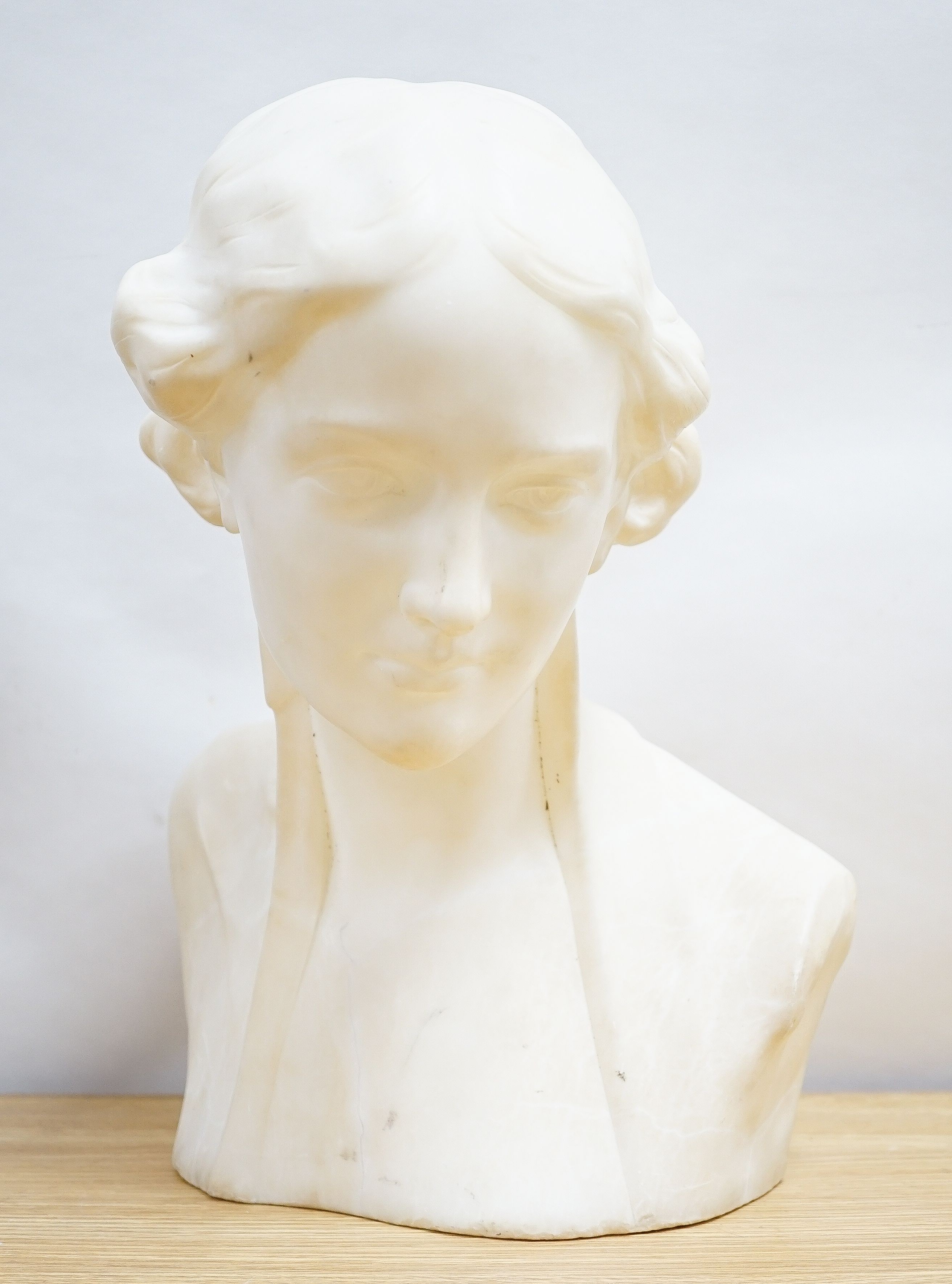 Valmore Gemignani, Italian 1879-1958, a carved alabaster bust of a lady, signed, 38cm